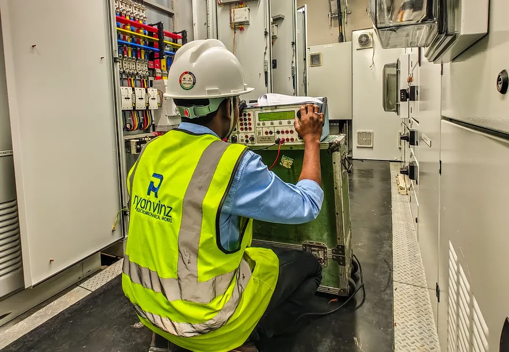 Ryan Vinz technician performing relay testing in a switchgear room